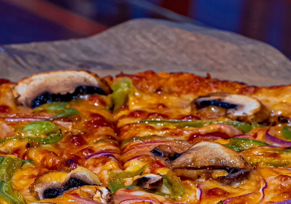 Bar style pizza with mushrooms, peppers and red onion at Vans Craft Kitchen in Danbury